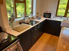 Solid wood kitchens with quartz worktops.