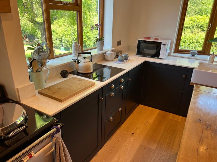 Solid wood kitchens with quartz worktops.