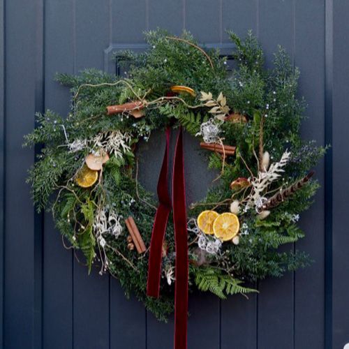 festive christmas wreath on door