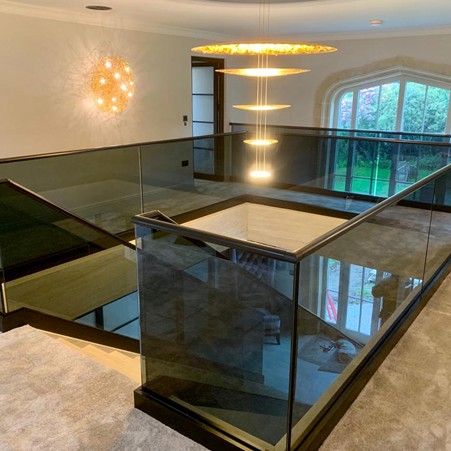 Feature Black Glass Staircase and Balustrade