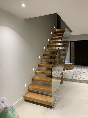 Est 1989 Staircase both floating and central spine