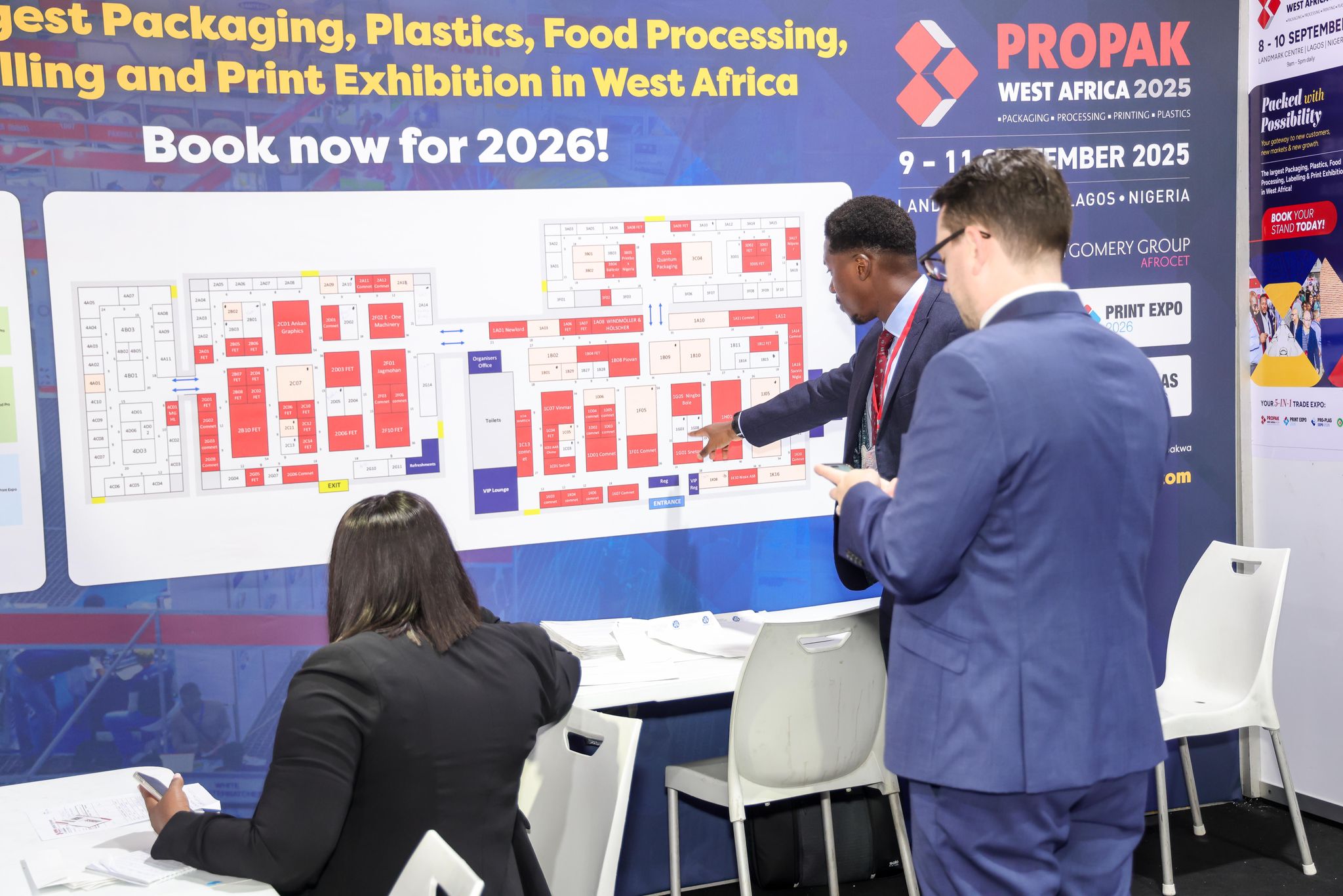 Visitors exploring the floor plan