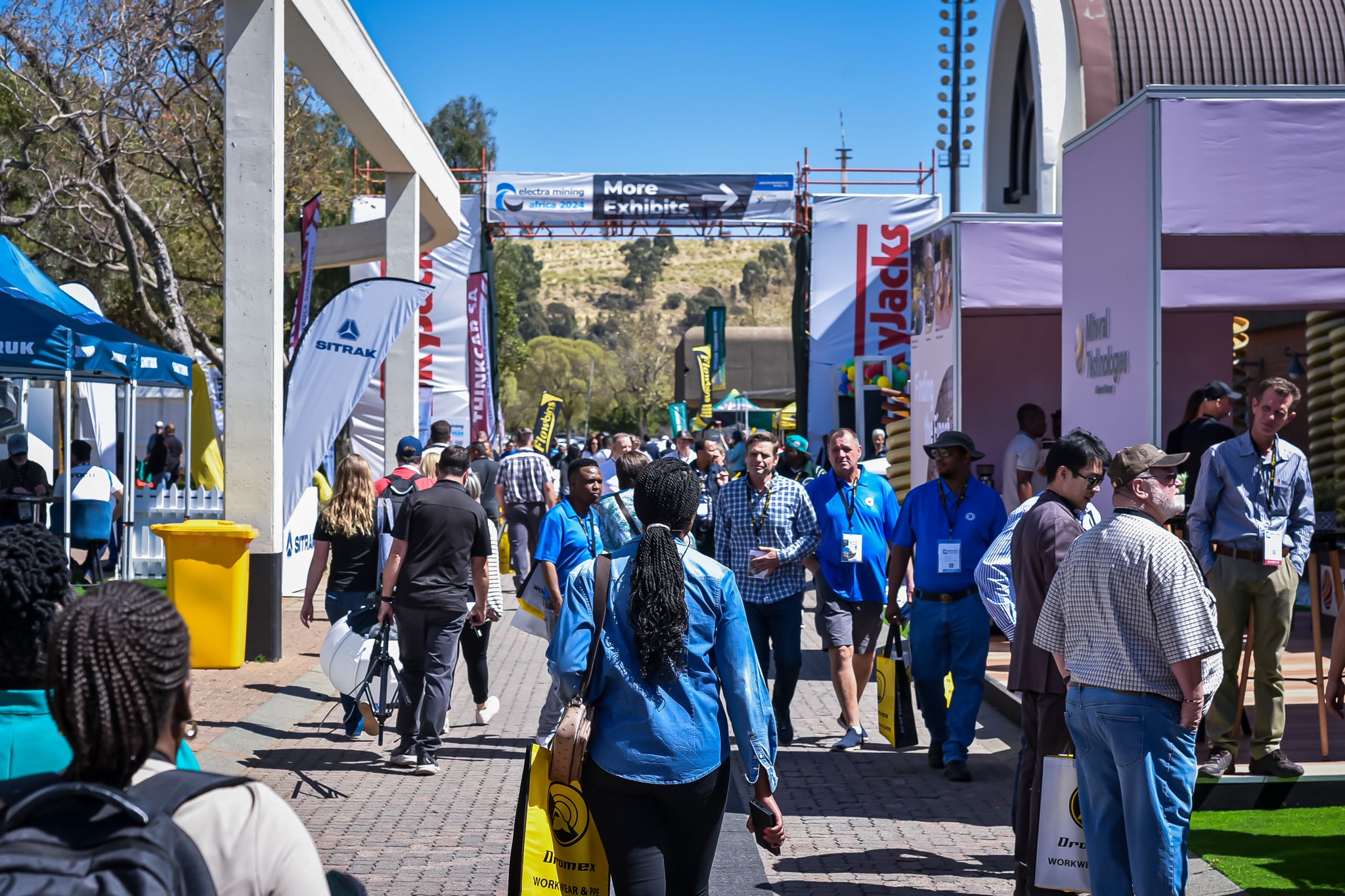 visitors interacting with exhibitors