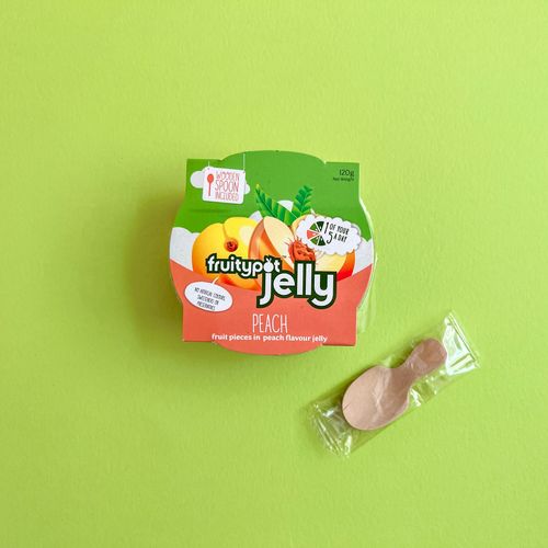 Fruitypot peach pieces in peach jelly with wooden spoon