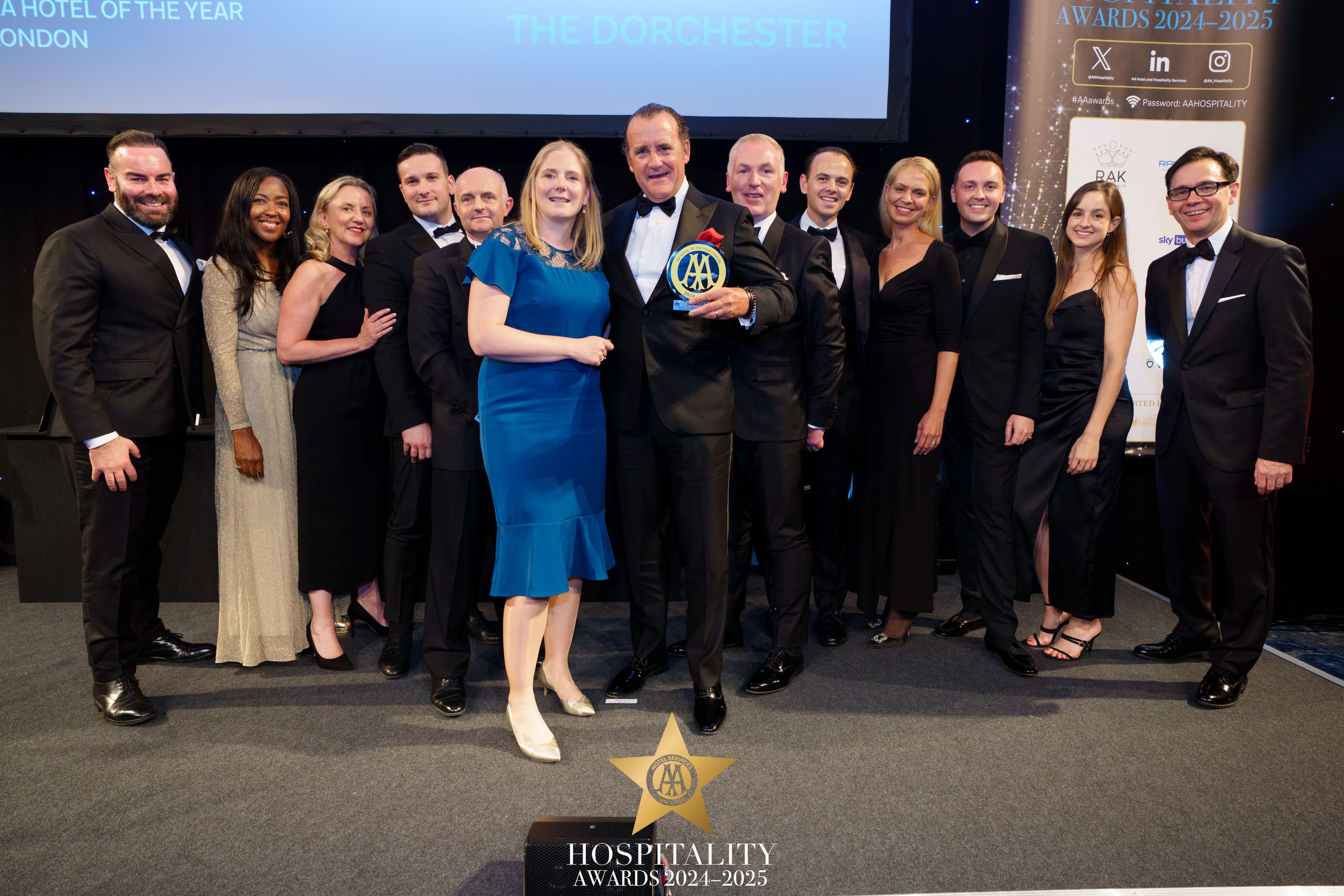 Image of The Dorchester team collecting their award at the AA Hospitality Awards