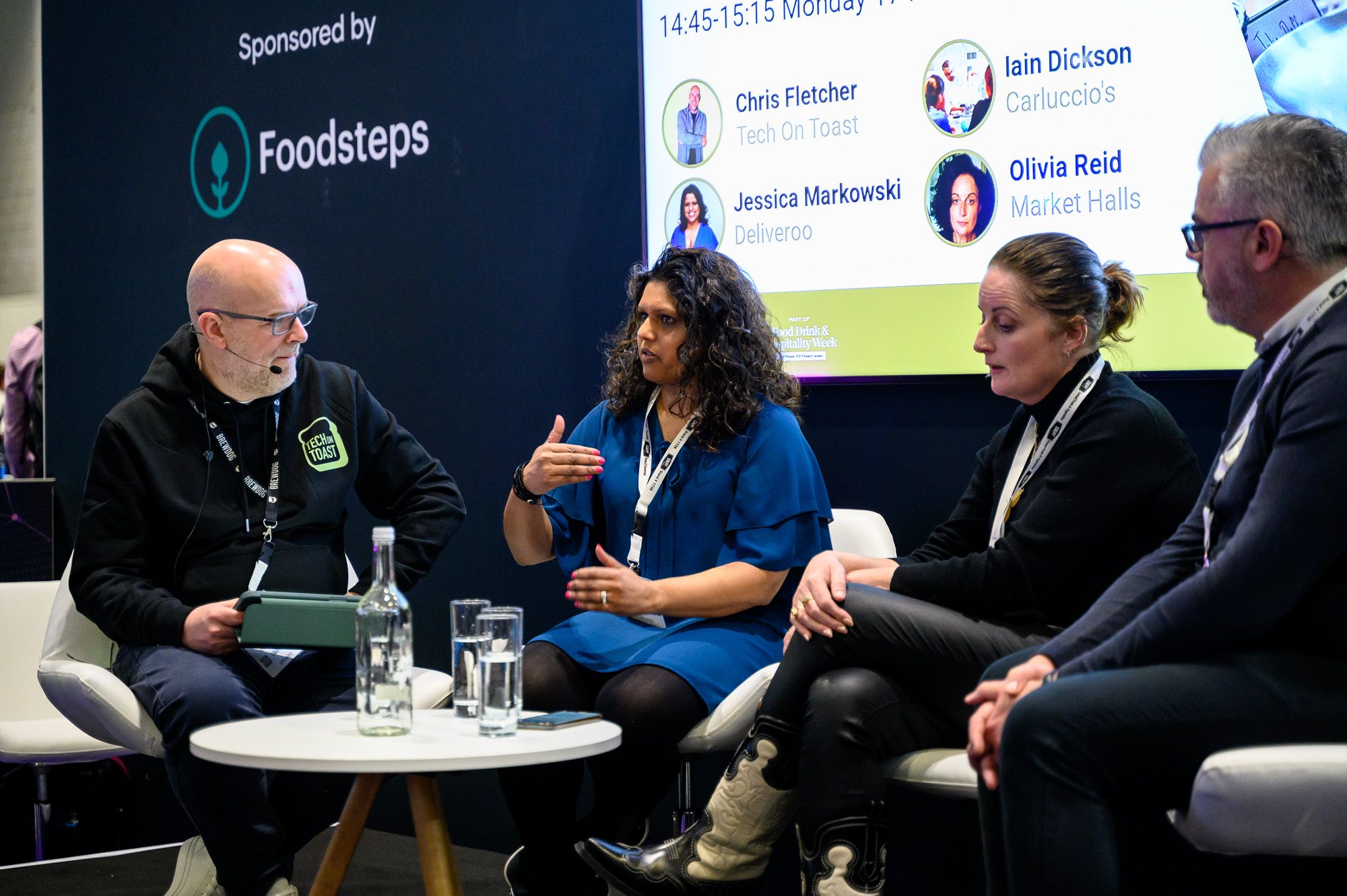 TechX Stage at HRC 2025 with panel of speakers in discussion