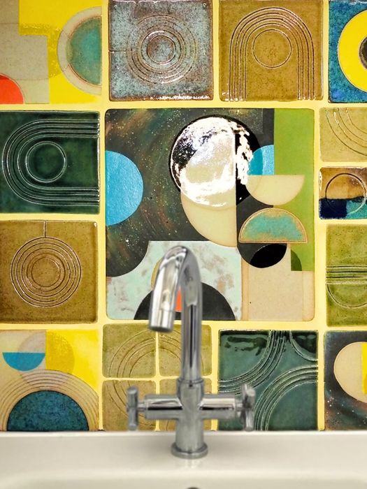 Handmade ceramic tiles with sculptural utilitarian elements.