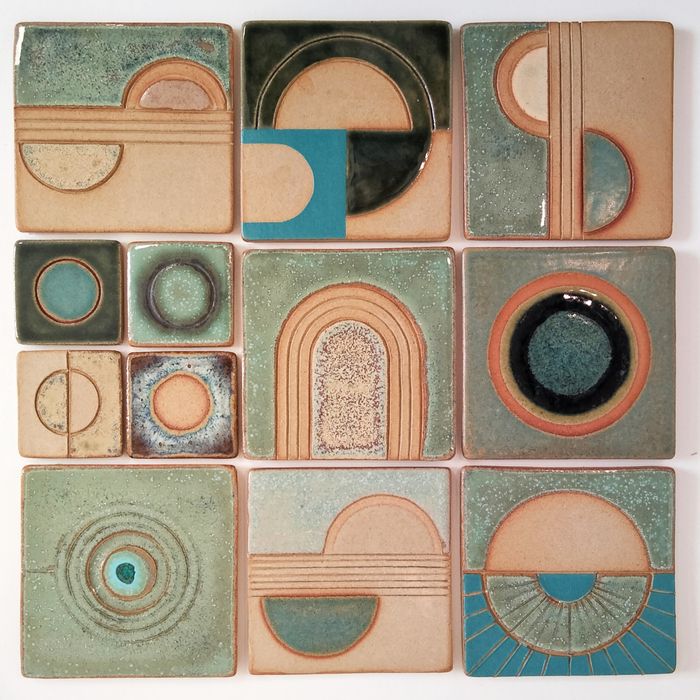 Handmade ceramic tiles with sculptural utilitarian elements.