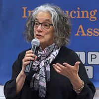 Image of Lainey Feingold Civil Right Attorney speaking into microphone