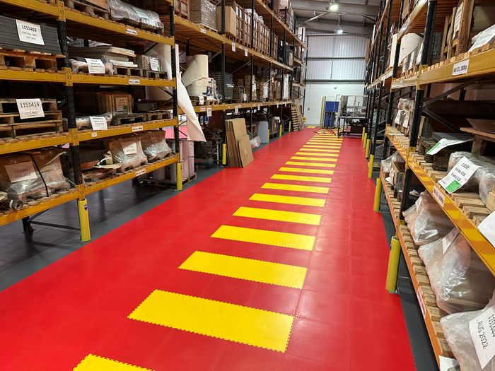 Safety floor layouts and messages using interlocking floor tiles