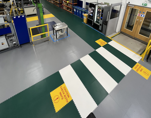 Safety floor layouts and messages using interlocking floor tiles