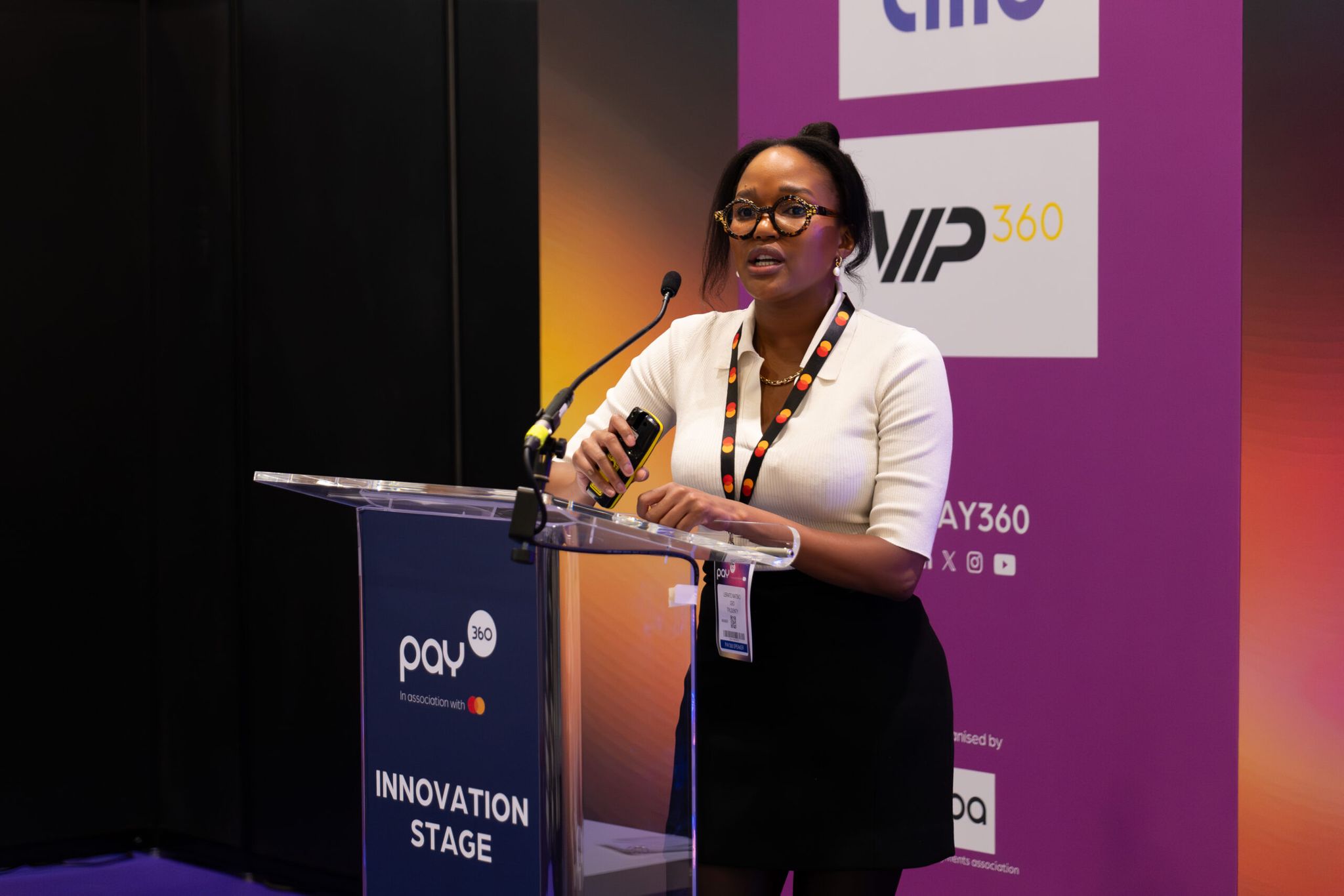 woman on stage at pay260, innovation stage