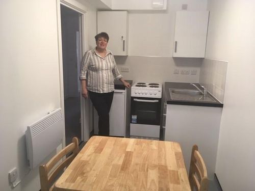 A council has kept its pledge to reduce the number of homeless families by opening a new development of flats