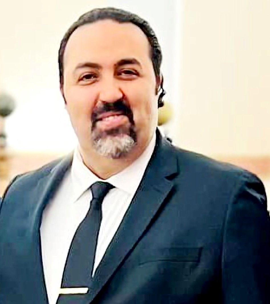 A. David Okbani