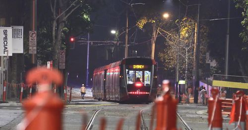 A sight to behold as Sydney's first tram in 60 years passes through George Street.