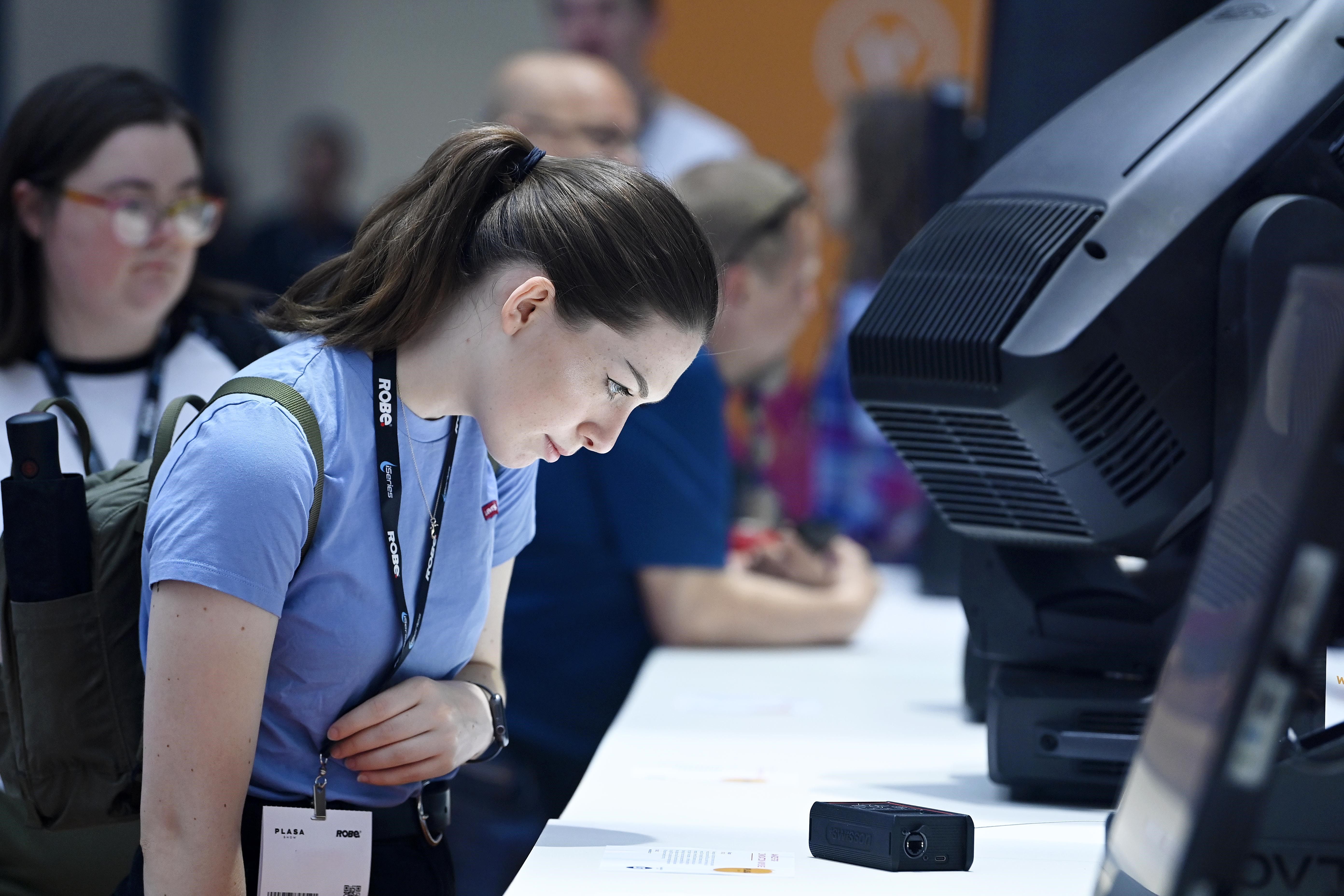 Young woman looking at product on Innovation Gallery at PLASA Show