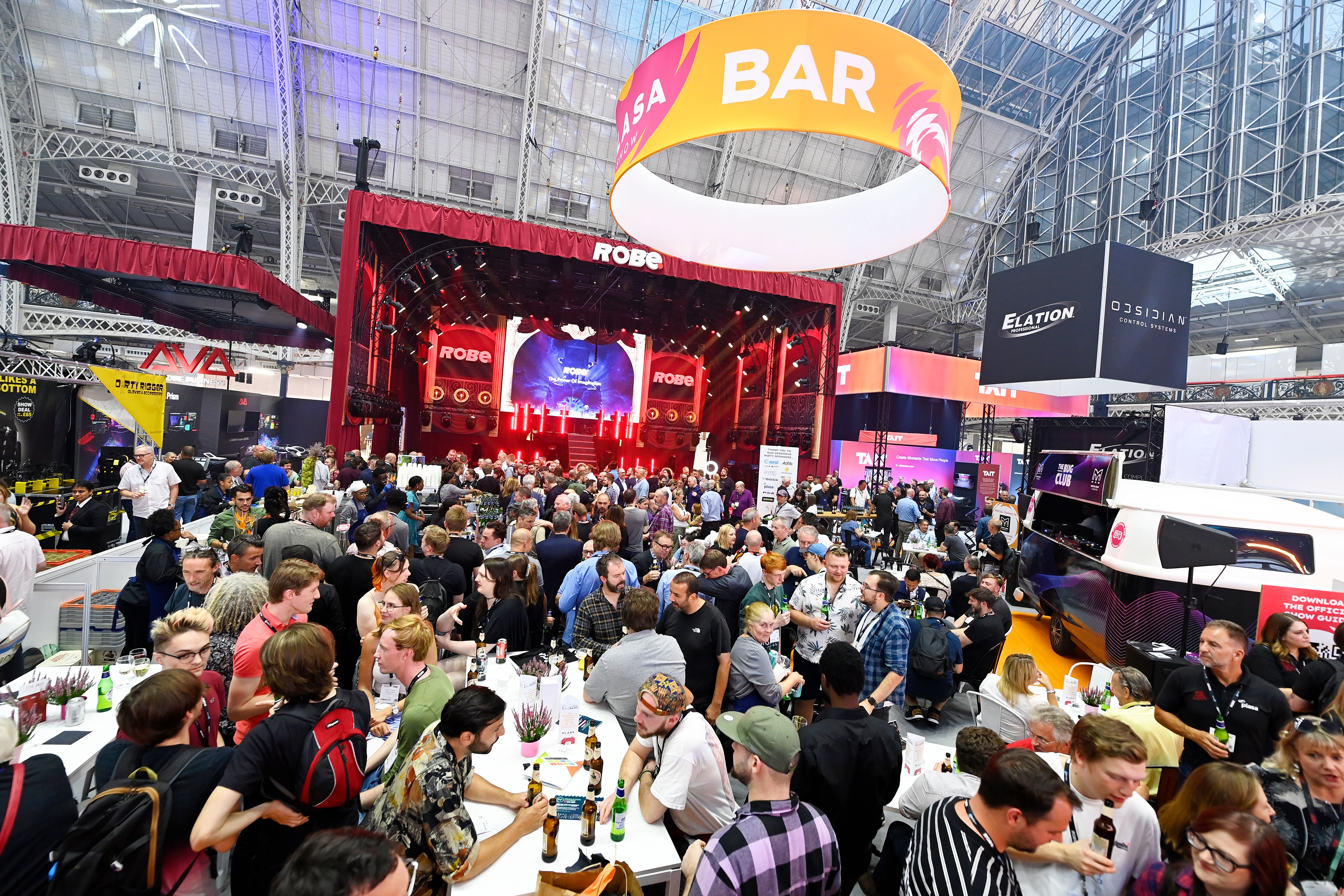 wide view of busy plasa show after party