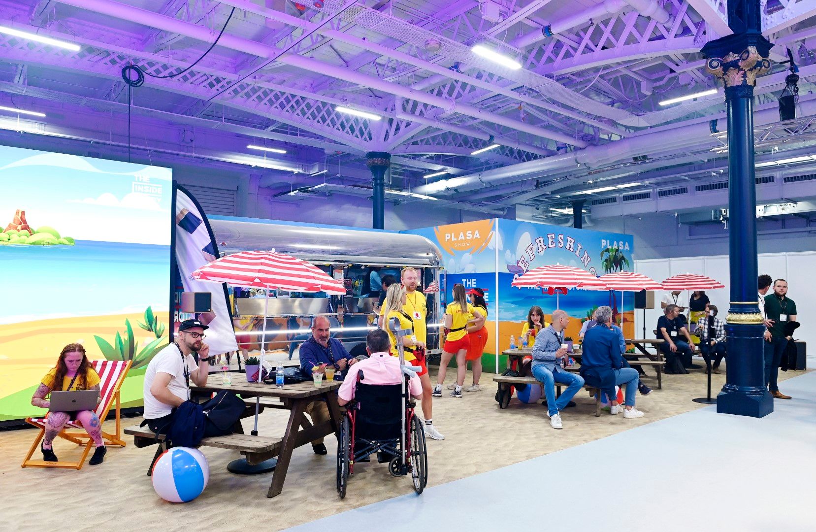 a beach style indoor bar with benches and beach parsoles