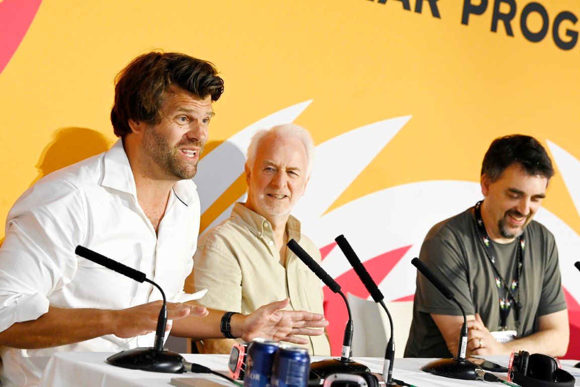 Three male speakers on seminar panel