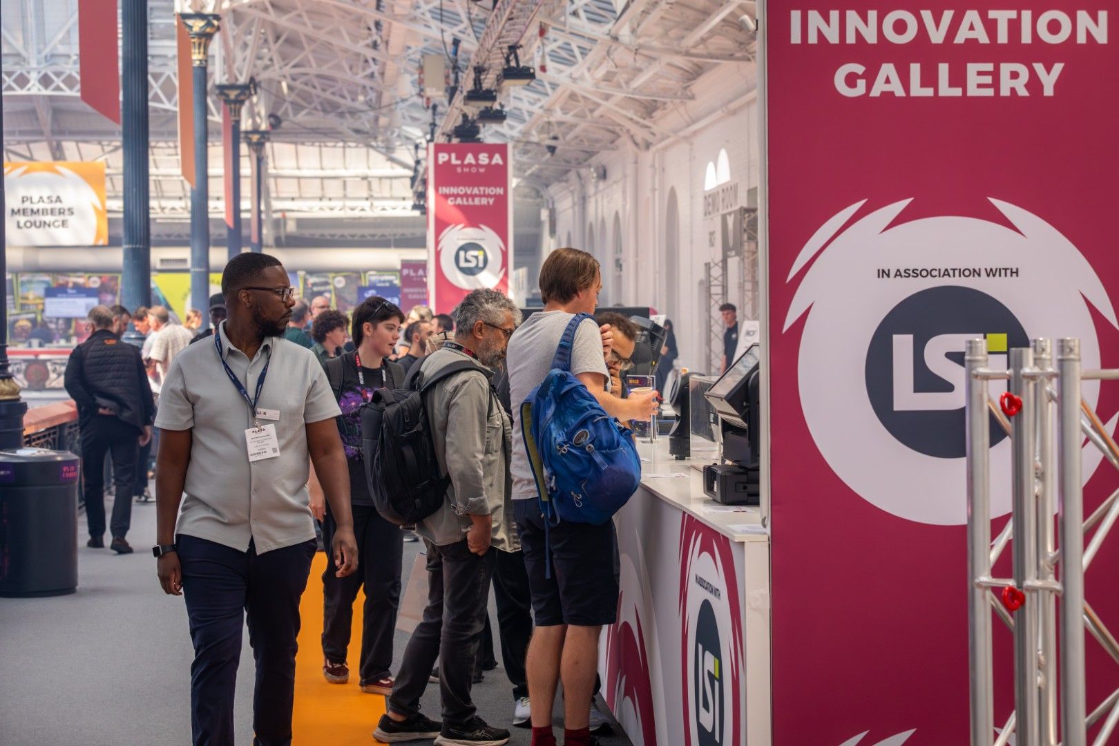 Visitors explore the Innovation Gallery at PLASA Show London 2025, presented in association with LSi Magazine, inside Olympia London’s Grand Hall.