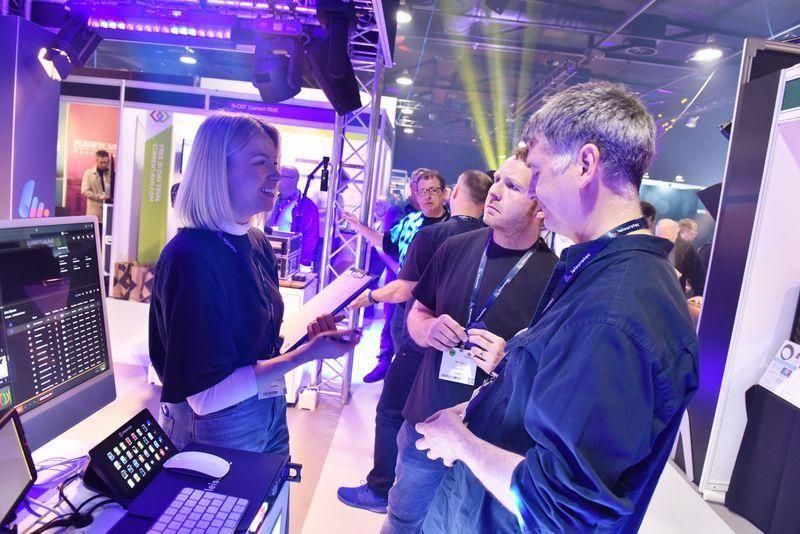 Female staff member from Leisure tech at an entertainment technology trade show run by PLASA