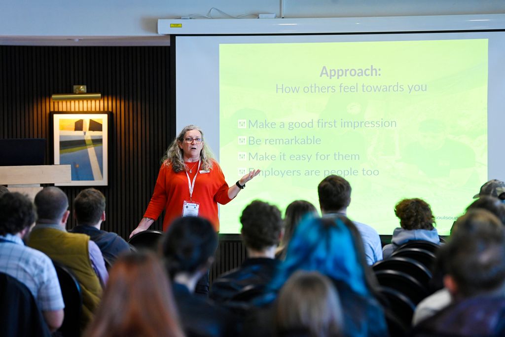A woman presenting on stage at PLASA Focus Leeds
