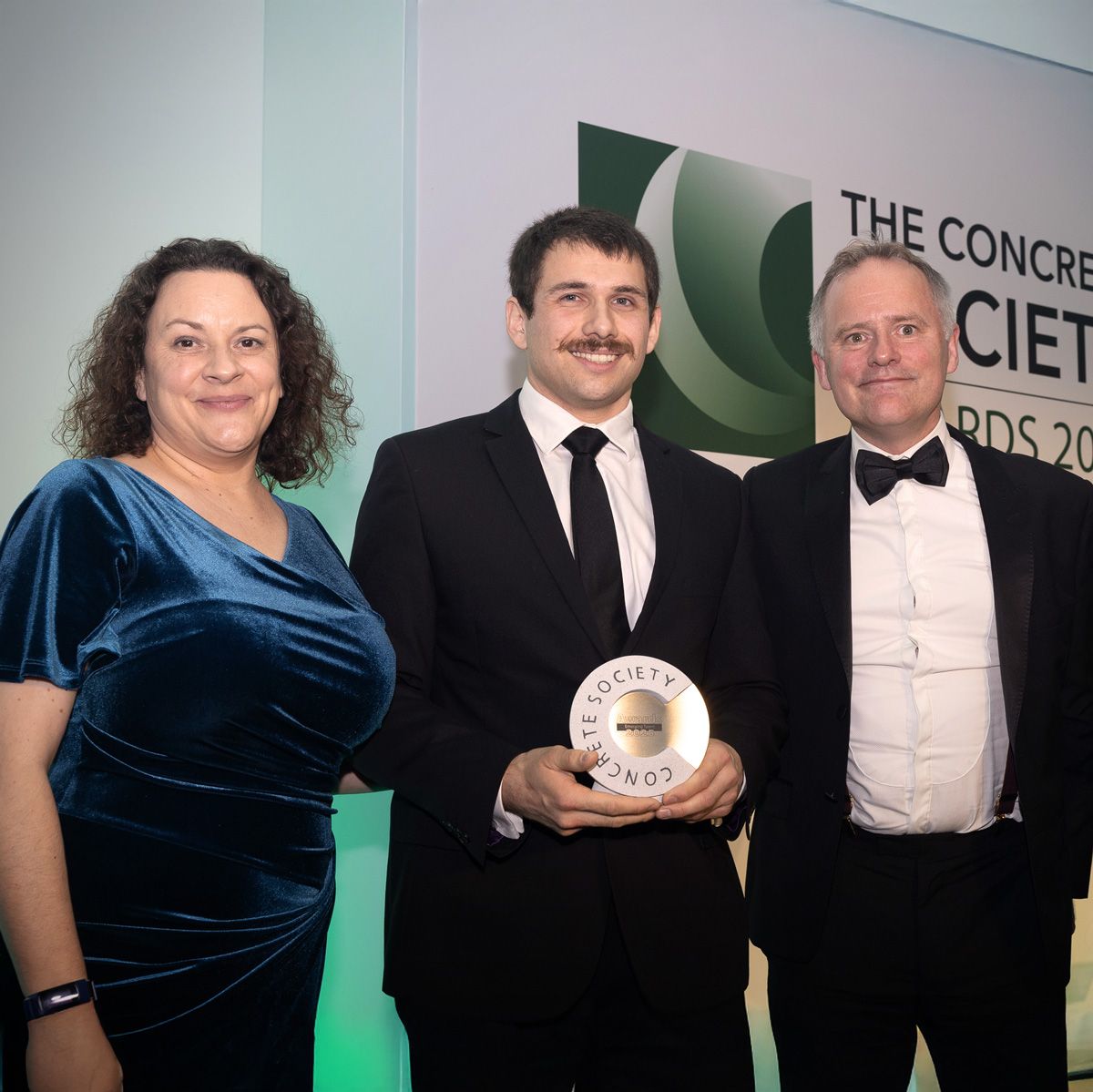 George Bowman receives the inaugural Award. From left to right: Claire Ackerman, Concrete Society Chief Executive, George Bowman, and Richard Bradbury, Managing Director of The QMJ Group.