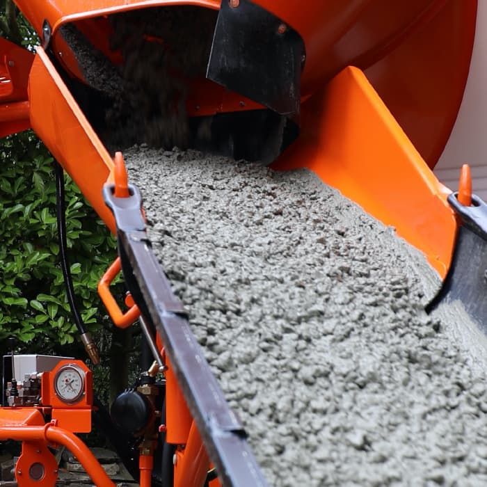 Concrete being poured from a mixer