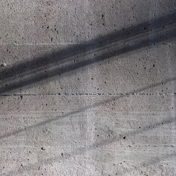 Shadow being cast over shuttered concrete