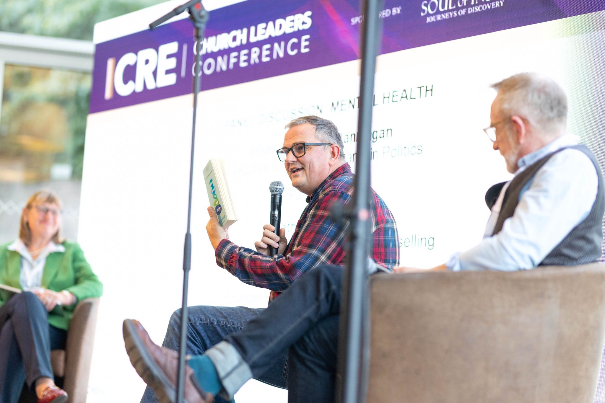 Speakers talking on stage