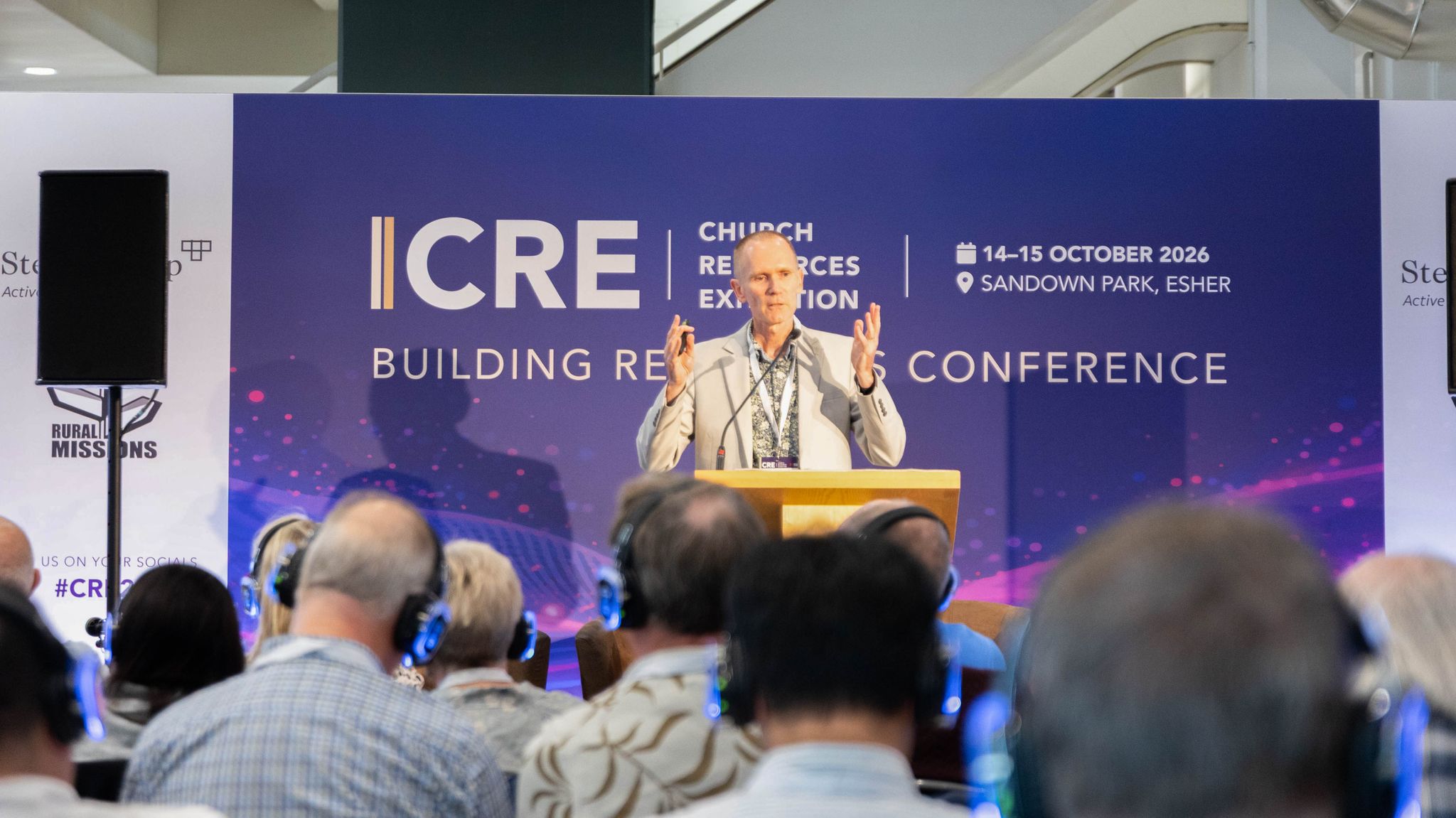 A male speaker talking at a conference