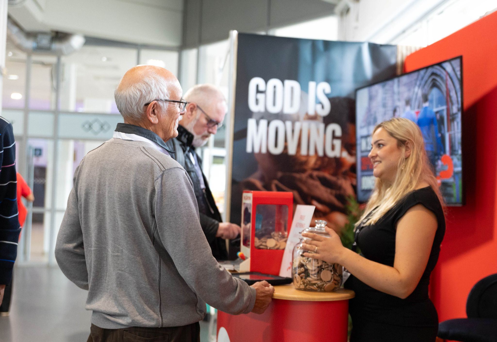 exhibitors at stand talking