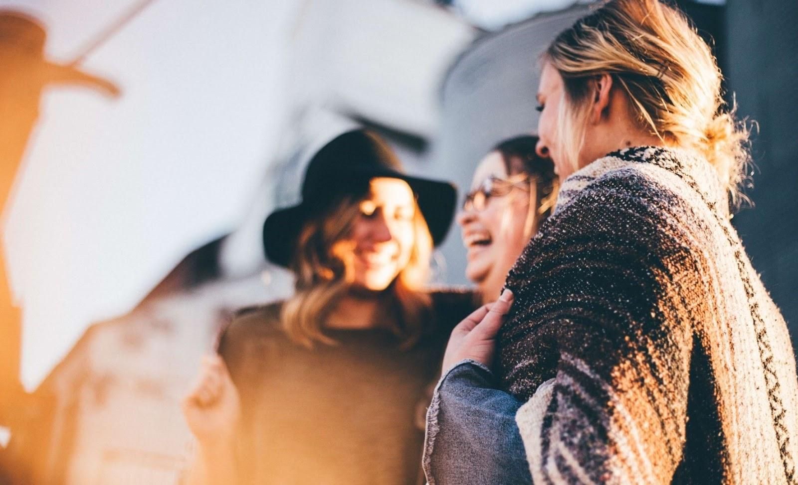 Picture of three women laughing.