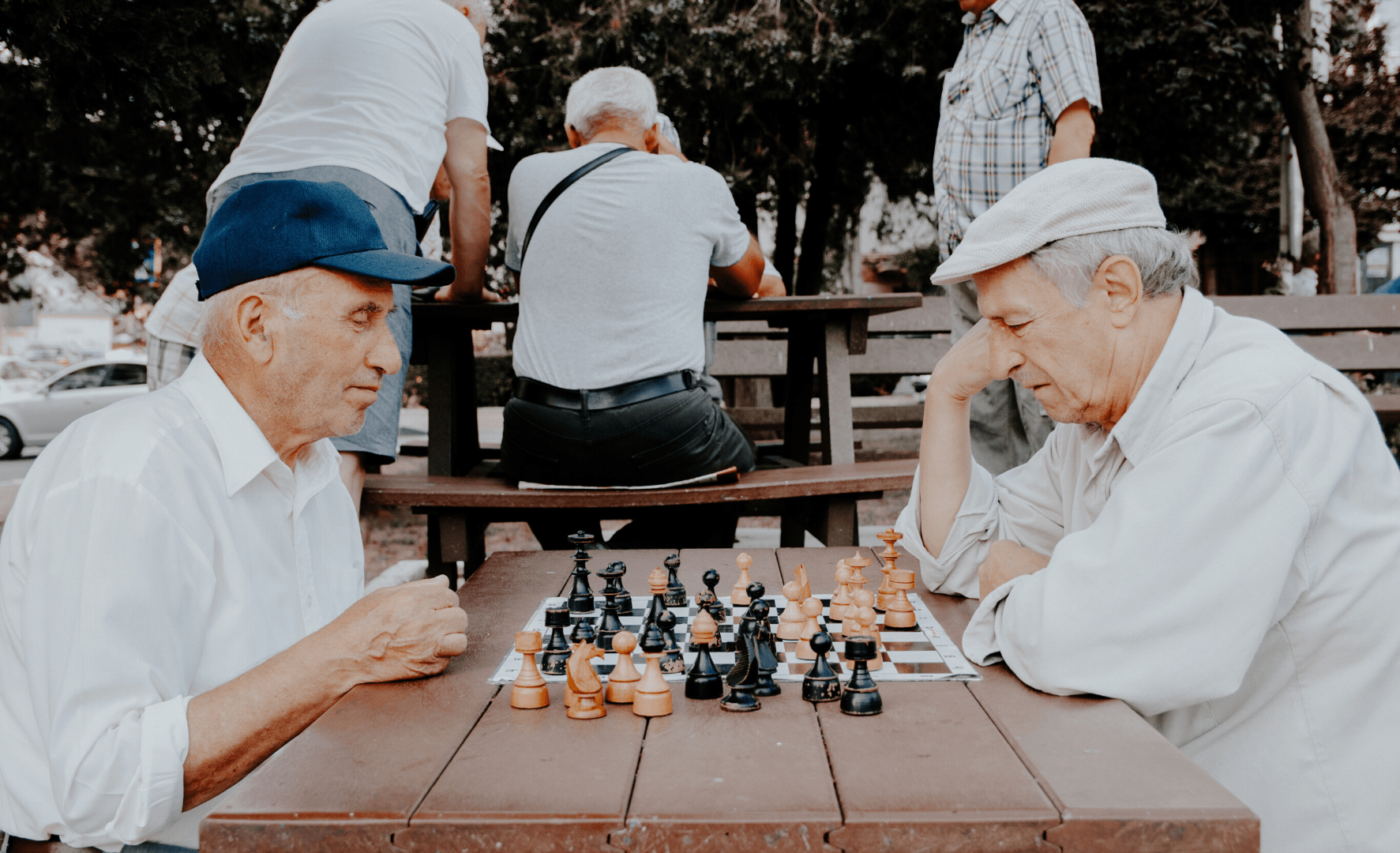 Picture of two elderly men playing chess.