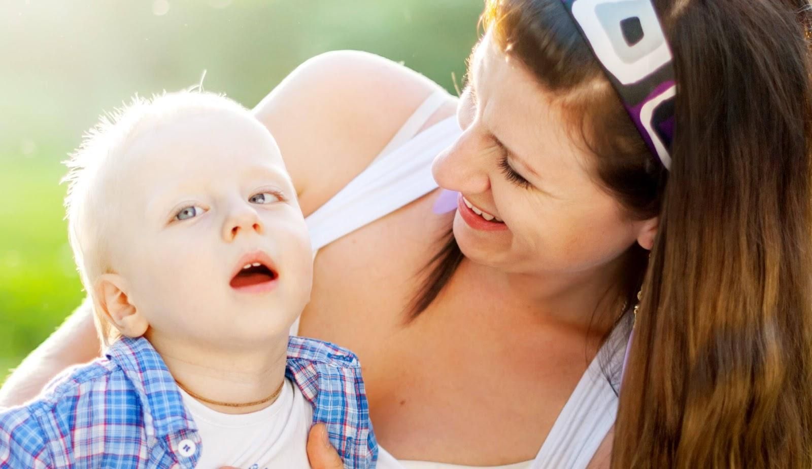 Image of a lady holding a baby