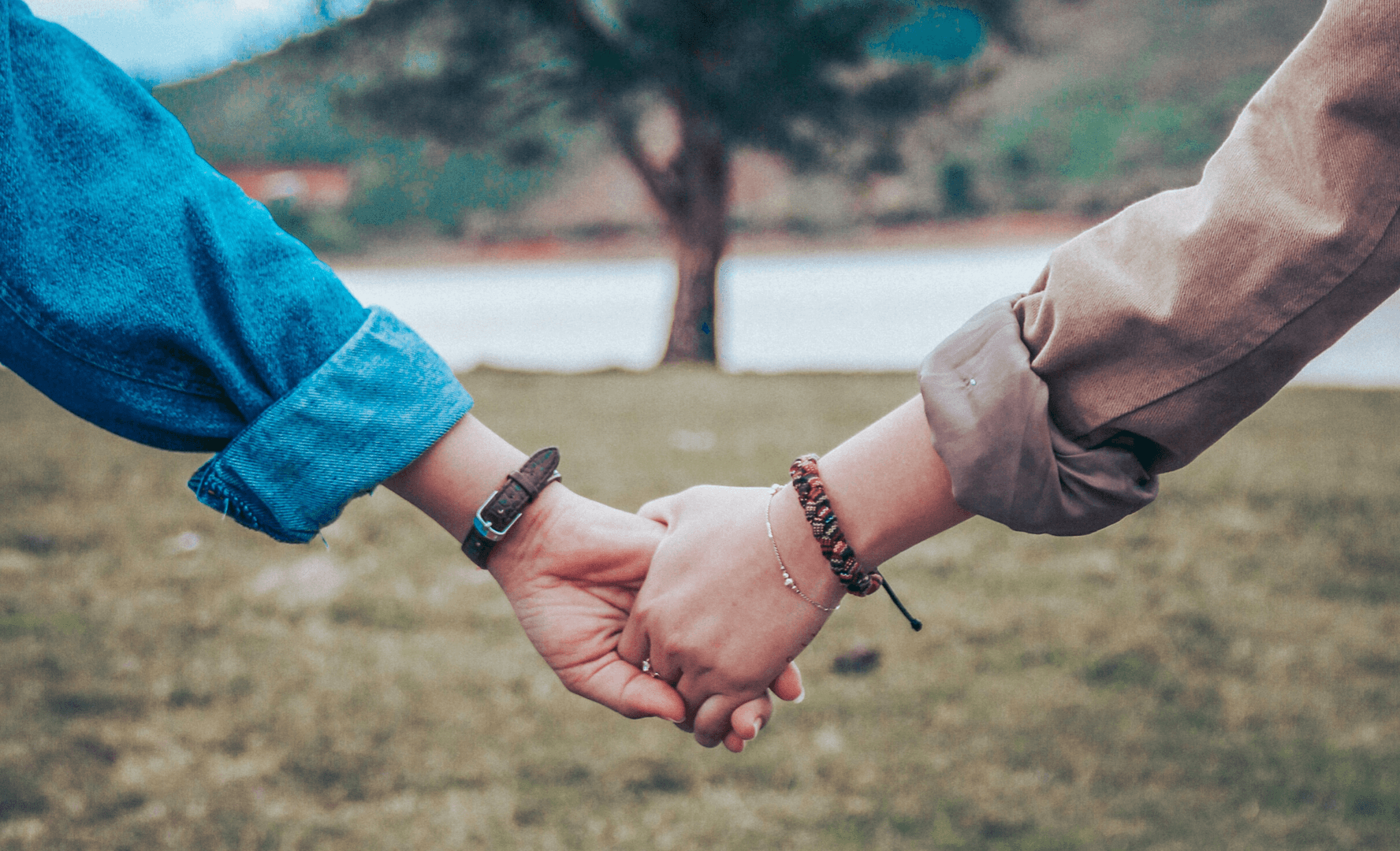 Picture of a couple holding hands. 