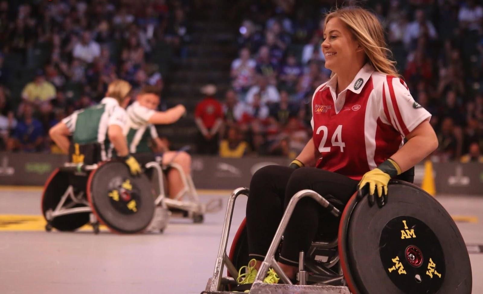 Picture of a young woman playing sports on a wheelchair.