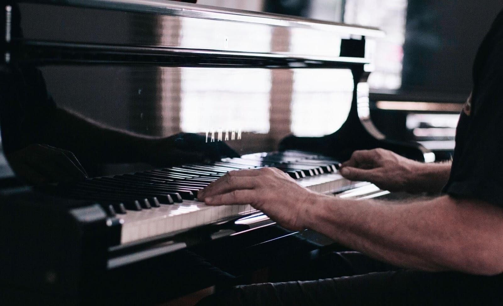 Picture of a person playing the piano.