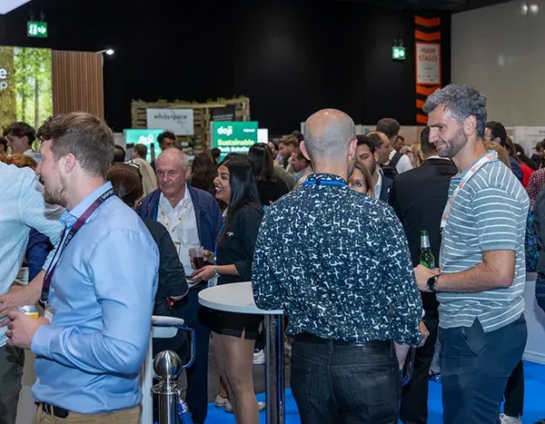 Attendees networking at Reset Connect London exhibition