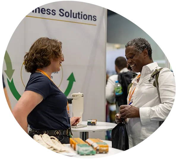 Exhibitors speaking with prospect at Reset Connect London