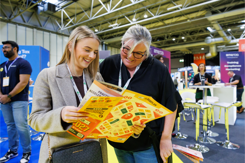 People looking at the FAB brochure