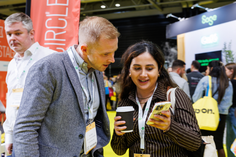 Attendees looking at phone.