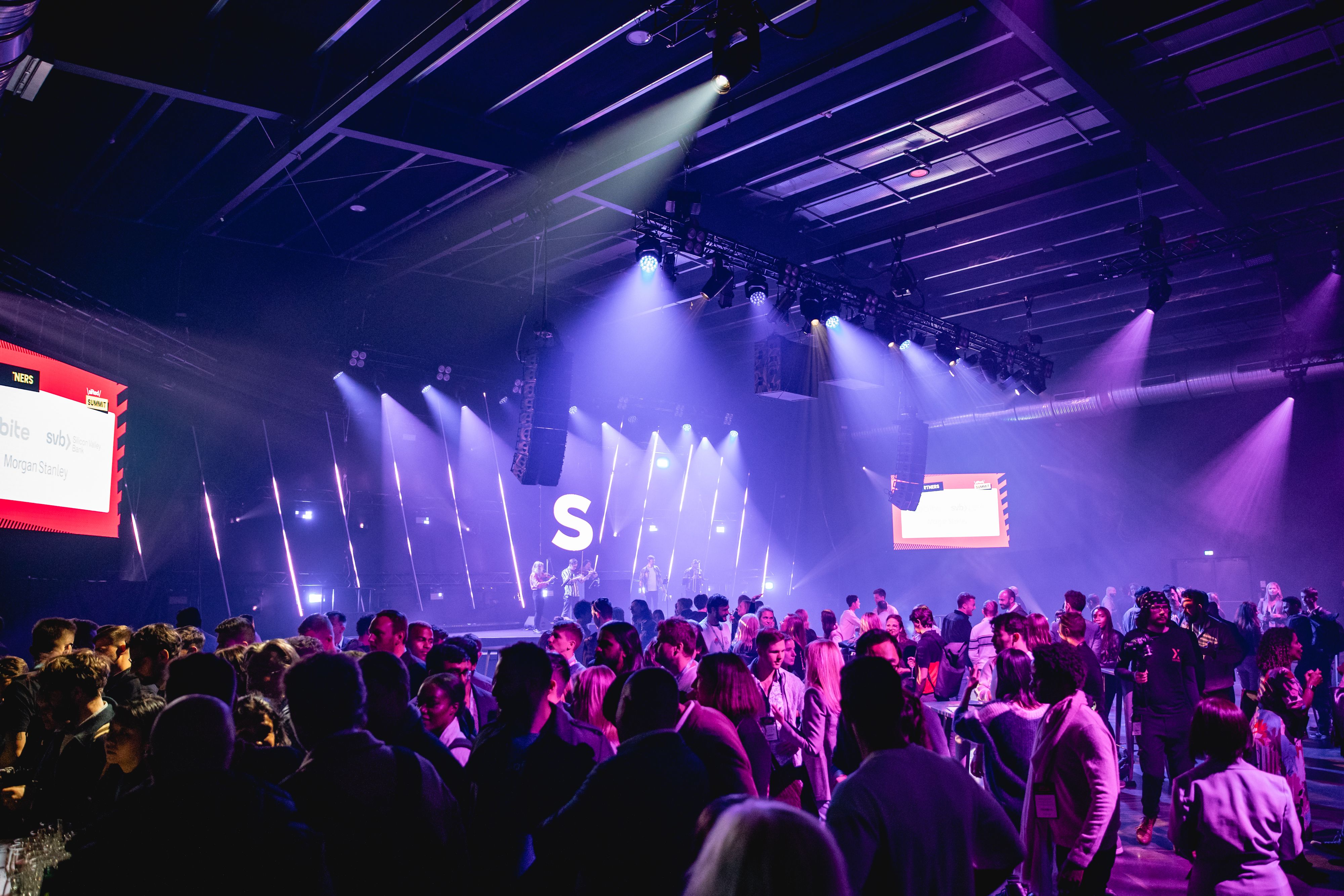 a large crowd in front of the stage at sifted summit