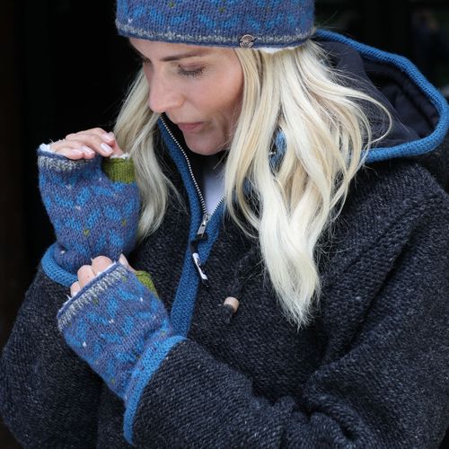 Blue edged charcoal hooded jacket worn with the chevron pattern set of headband and wristwarmers.