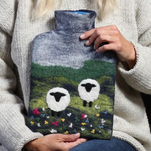 Pure wool hand felted decorated hot water bottle cover with non plastic hot water bottle included.