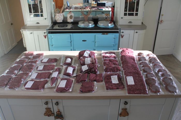 Whole deer, butchered into different cuts; packed & labelled
