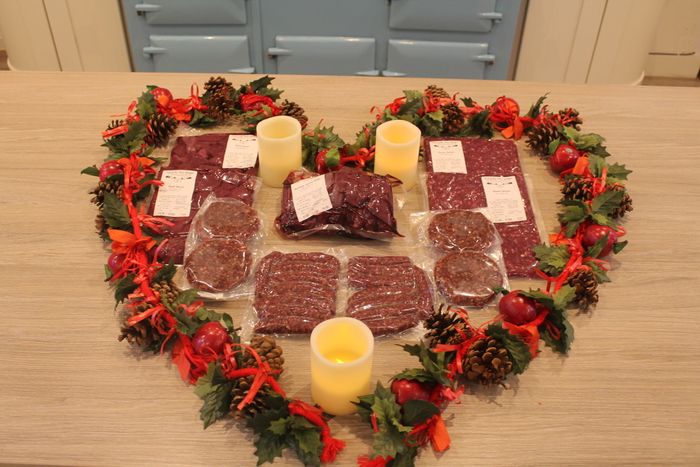 Whole deer, butchered into different cuts; packed & labelled