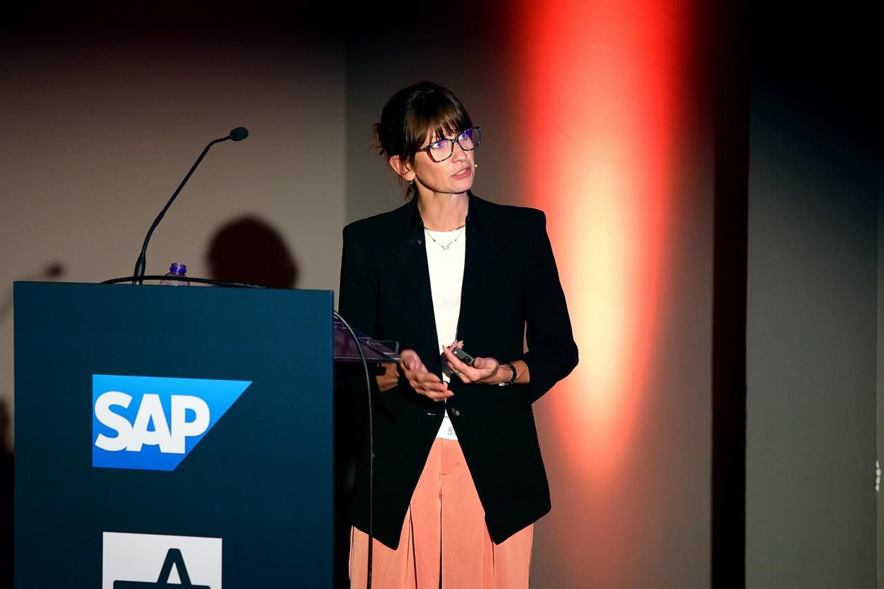 Female presenter on stage