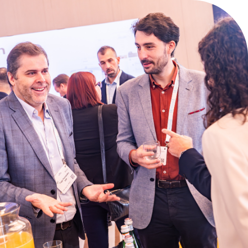 attendees chatting on exhibition floor