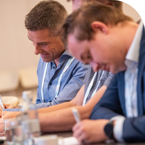 attendees taking notes